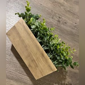 Fake plant with wooden planter